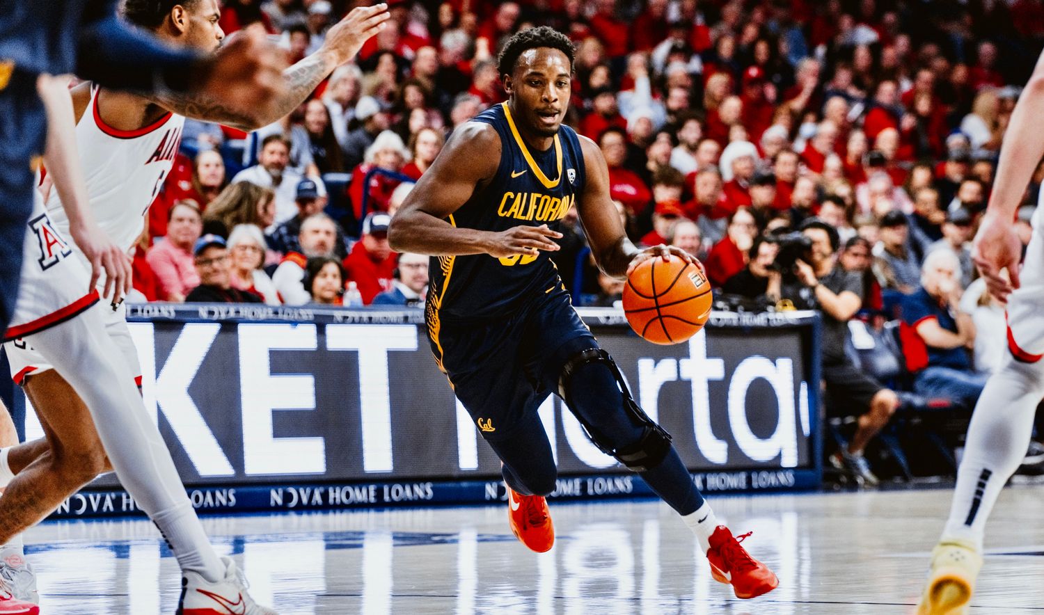 Jalen Celestine drives toward the basket.